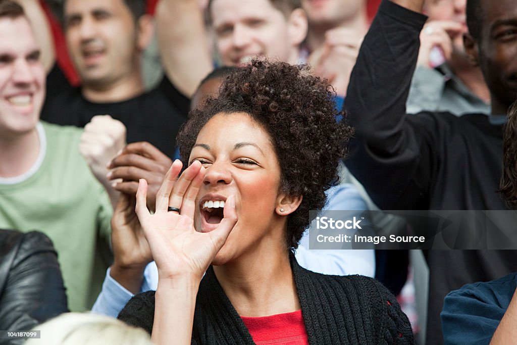 Shouting woman at football match  Fan - Enthusiast Stock Photo