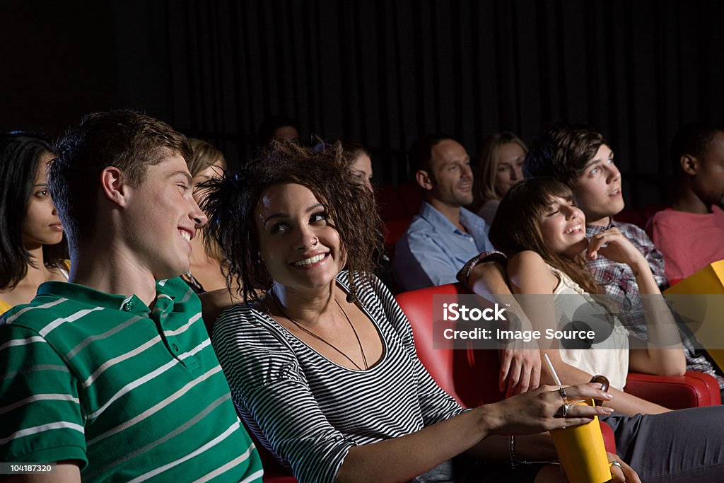 Young couples enjoying a movie  12-13 Years Stock Photo