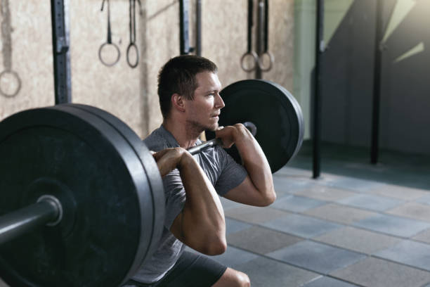 istock Sports Man Training, Lifting Barbell Row 1041890034