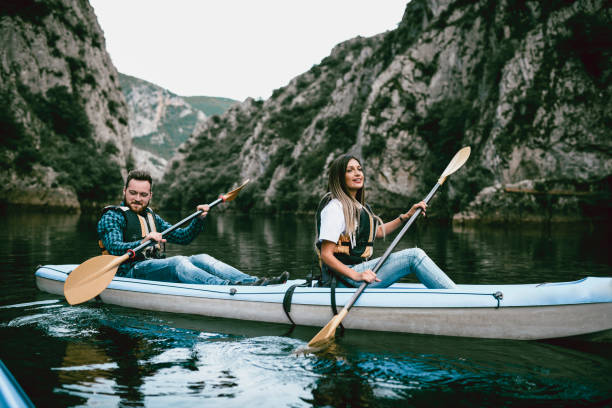 istock Cute Smiling Female On A Kayaking Trip With Brother 1041890378