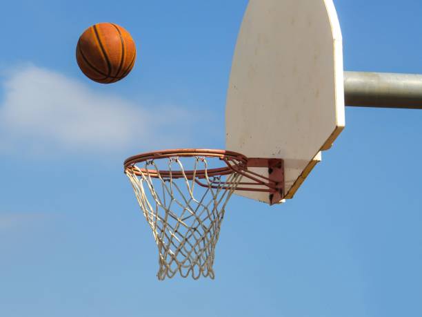 istock Basketball Flying Towards A Net Backboard 1041895720