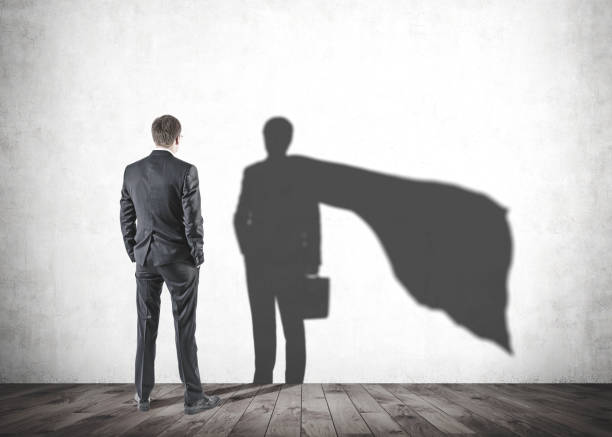 istock Businessman looking at his superman shadow 1041898836