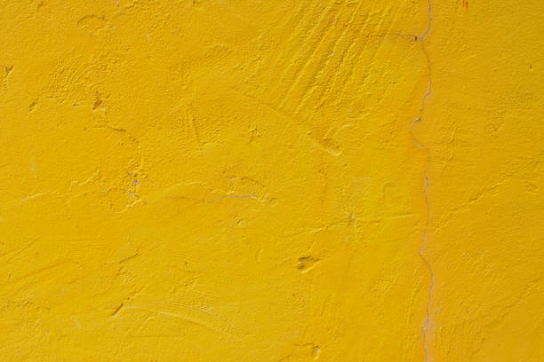 istock Yellow concrete wall texture and background 1041899126