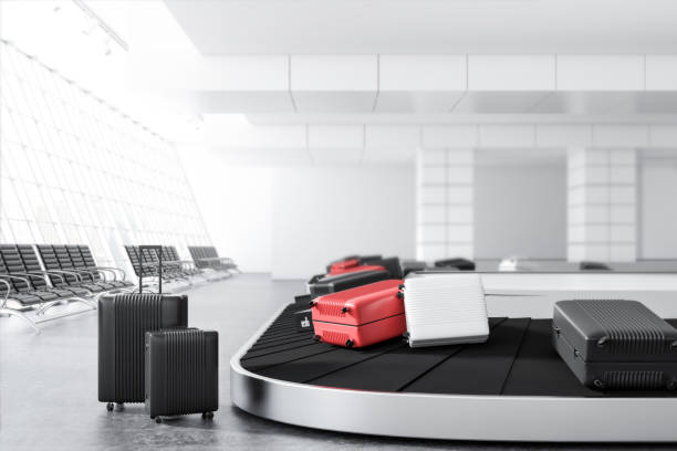 istock Suitcases on airport conveyor belt 1041899168