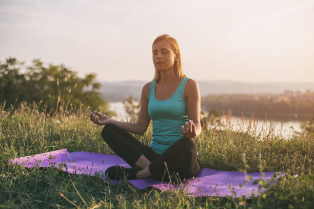 istock Sporty woman meditating 1041903114