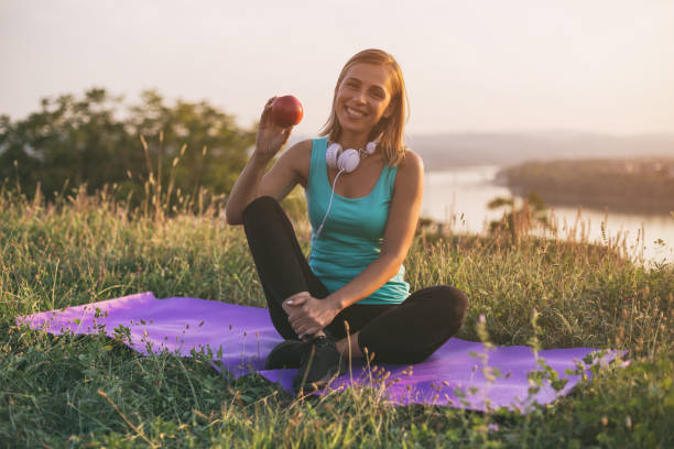 istock Sporty woman showing apple 1041907142