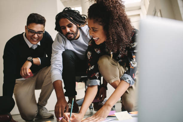 istock Happy business partners working together 1041907266