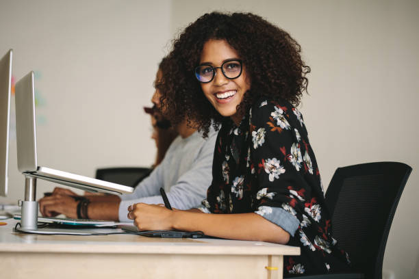 istock Smiling businesswoman working in office 1041909776
