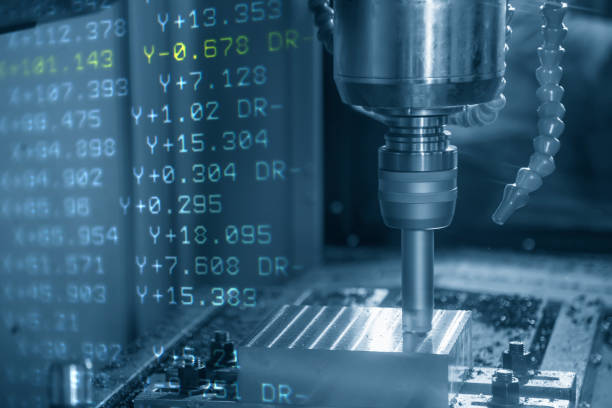 istock The abstract scene of  CNC milling machine and the G-code data cutting the mold part. 1041912900