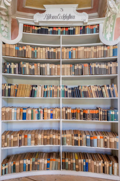 Füssen, Old Library at the St. Mang's Abbey (Bavaria, Germany) Old books divided by themes and ordered on shelves in the old Library at the St. Mang's Abbey, one of the landmarks of Füssen. st mang stock pictures, royalty-free photos & images