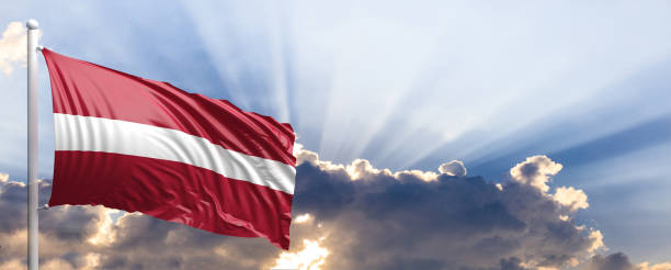 istock Latvia flag on blue sky. 3d illustration 1041923948