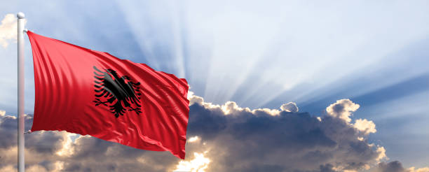 istock Albania flag on blue sky. 3d illustration 1041923960