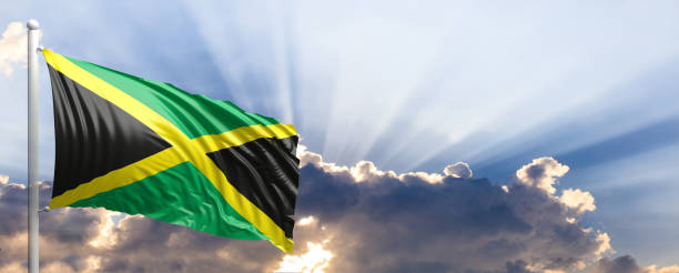 istock Jamaica flag on blue sky. 3d illustration 1041923980