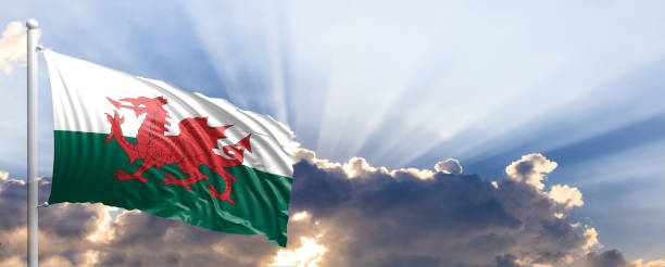 istock Wales flag on blue sky. 3d illustration 1041924146
