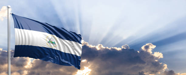 istock Nicaragua flag on blue sky. 3d illustration 1041924276