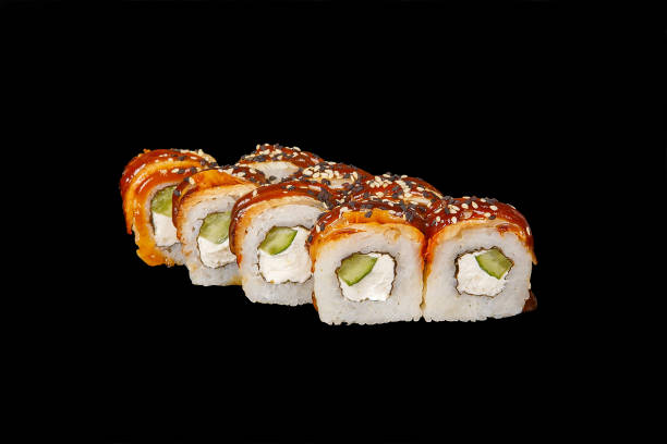 istock Sushi, rolls on a black isolated background 1041925030