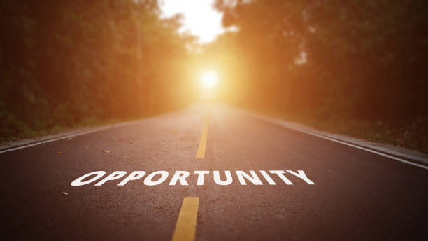 istock Conceptual image with word opportunity on asphalt road. 1041926346