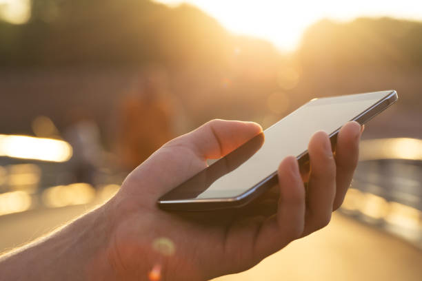 istock Man using his Mobile Phone outdoor 1041939680