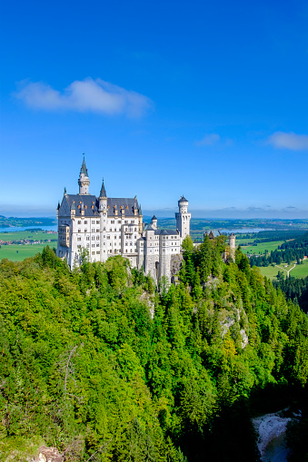 Neuschwanstein Castle is a beautiful palace built on a rugged hill by Ludwig II of Bavaria in the 19th-century. It is located on the famous Romantic Road (Romantische Straße), a 