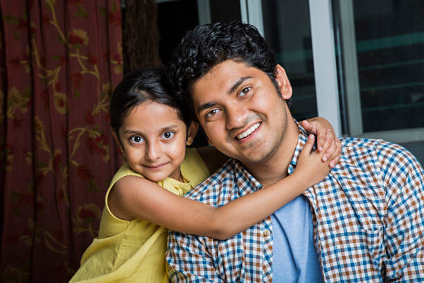 istock Daughter Giving His Father a Hug - Stock image 1041947330