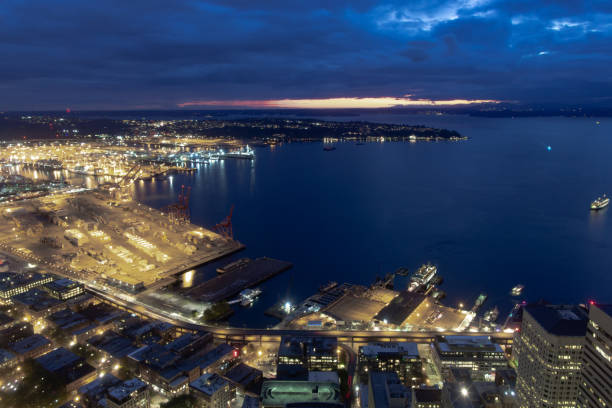 seattle waterfront ferry terminal and harbor aerial at night - seattle night skyline architecture and buildings imagens e fotografias de stock