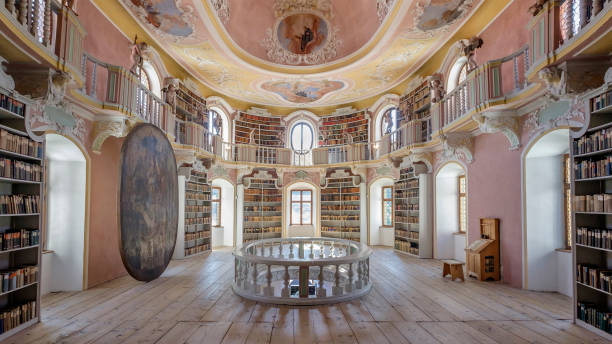 Füssen, Old Library at the St. Mang's Abbey (Bavaria, Germany) Old books divided by themes and ordered on shelves in the old Library at the St. Mang's Abbey, one of the landmarks of Füssen. st mang stock pictures, royalty-free photos & images