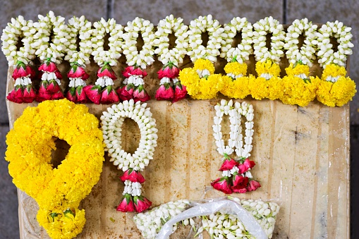 Floral garlands on street vendor stall (aerial view)