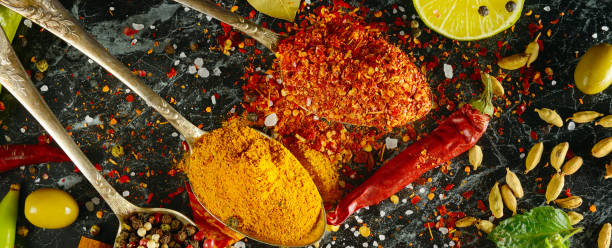 istock Variety of spices and herbs on kitchen tabl 1041952132