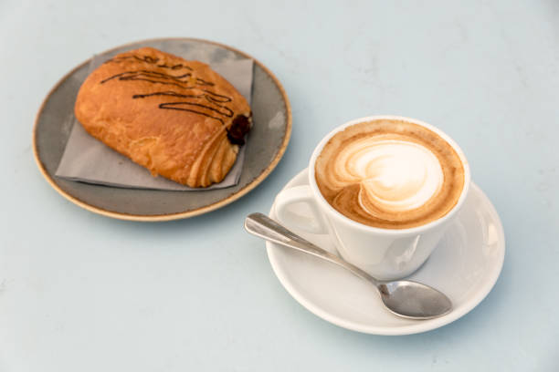 istock Breakfast at the beach with pasta and capuccino 1041955432