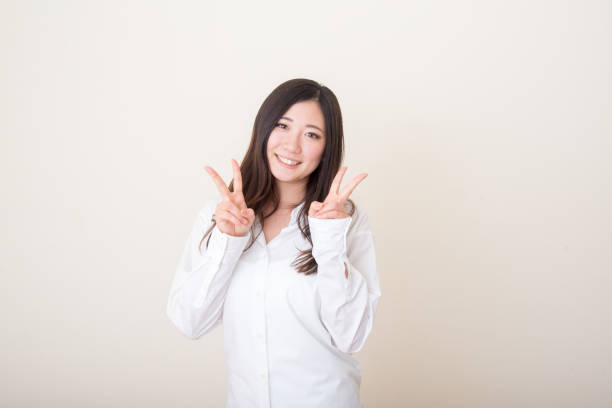 istock young asian woman with peace sign 1041960306