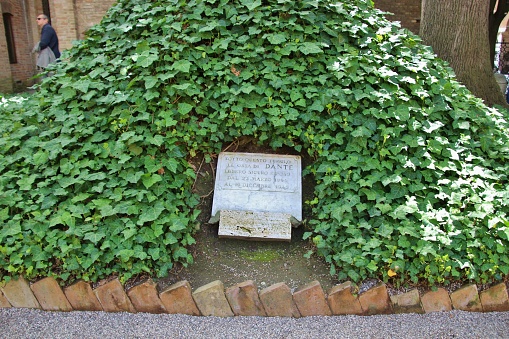 Ravenna, Italy - April 14, 2018: Temporary tomb of the poet Dante Alighieri in Ravenna. Inscription: „This was the secure grave of the bones of Dante between march 1944 and december 1945.“ South Europe.