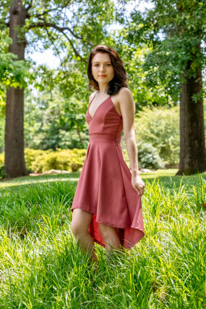Eighteen Year Old Woman Enjoys Being Outdoors in a Park stock photo