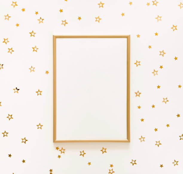 istock hristmas background from gold  Christmas decorations stars and frame mock up  . Xmas composition of New Year's Christmas balls. Winter holiday concept.Flat lay. Top view. Copy space 1041968792