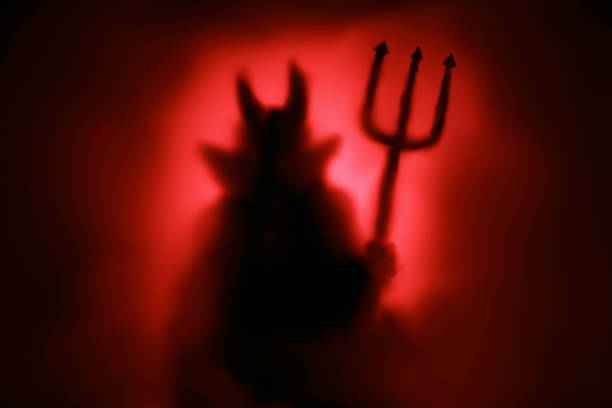 Creepy Devil silhouette Creepy Devil silhouette from hell in the mist with backlit. devil stock pictures, royalty-free photos & images