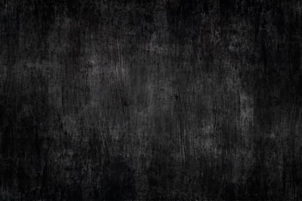 istock a black painted metal background with brush strokes 1041971242