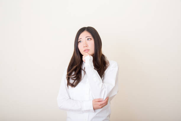 istock young asian woman wondering 1041971384