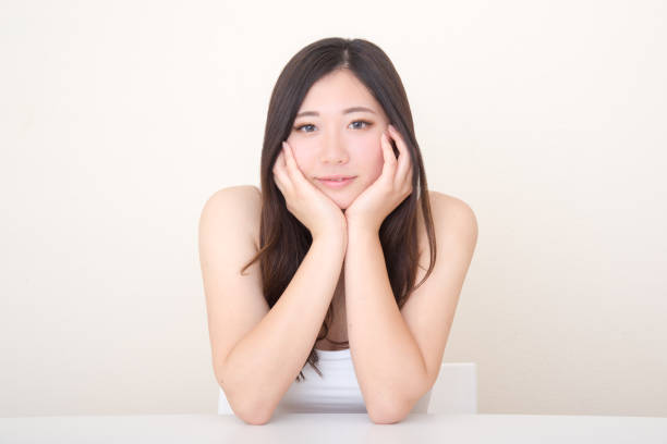 istock young asian woman posing at table 1041972076