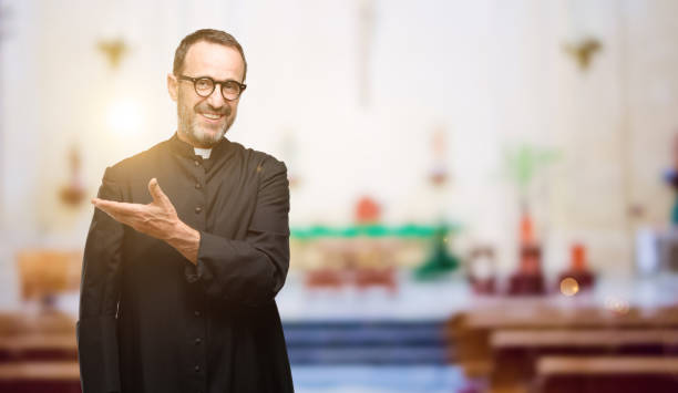 istock Priest religion man holding something in empty hand 1041972392