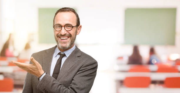 istock Teacher man using glasses holding something in empty hand 1041972670