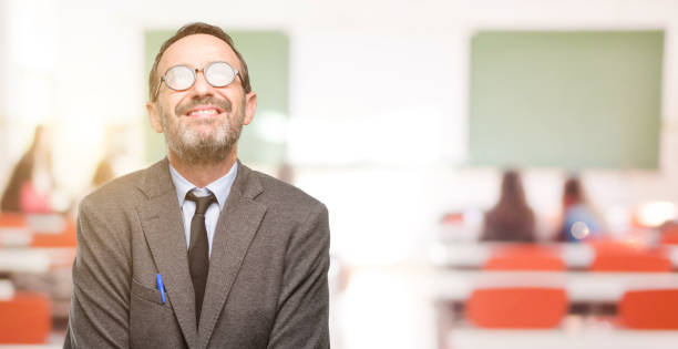 istock Teacher man using glasses thinking and looking up expressing doubt and wonder 1041972758