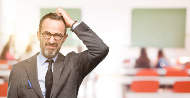istock Teacher man using glasses doubt expression, confuse and wonder concept, uncertain future 1041972790
