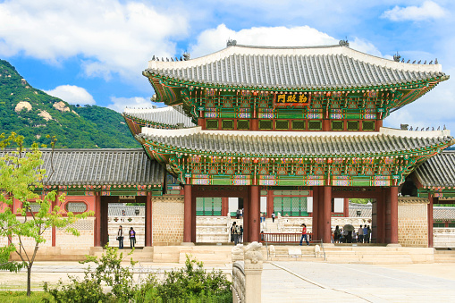 Gyeongbokgung Palace (also known as Gyeongbok Palace), was built in 1395 as the main royal palace of the Joseon dynasty. It is located in northern Seoul, South Korea. Sightseeing tourists are in the image.