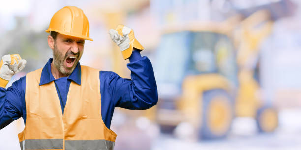 istock Senior engineer man, construction worker happy and excited celebrating victory expressing big success, power, energy and positive emotions. Celebrates new job joyful 1041975828