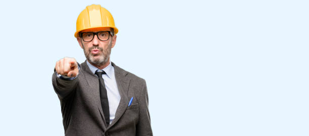istock Senior architect or engineer pointing to the front with finger 1041976464