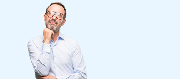 istock Middle age man with glasses thinking and looking up expressing doubt and wonder 1041977560