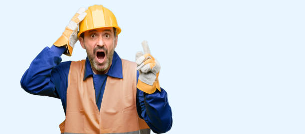 istock Senior engineer man, construction worker pointing away side with finger 1041977776