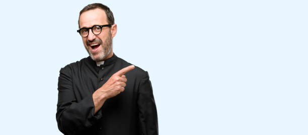 istock Priest religion man pointing away side with finger 1041978526