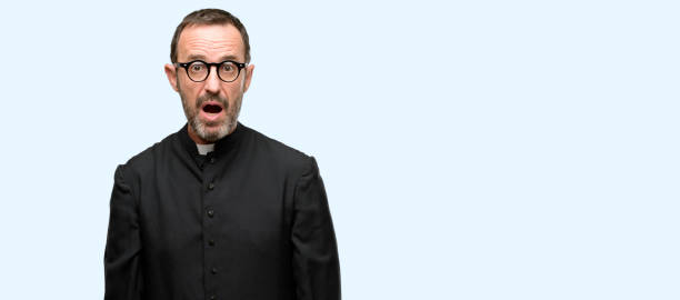 istock Priest religion man scared in shock, expressing panic and fear 1041978540
