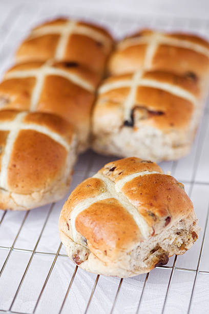 Hot cross buns on a baking tray stock photo