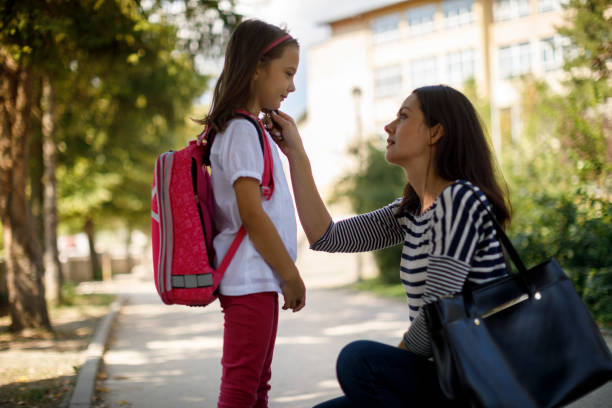 istock Mother taking daughter to school 1041984920